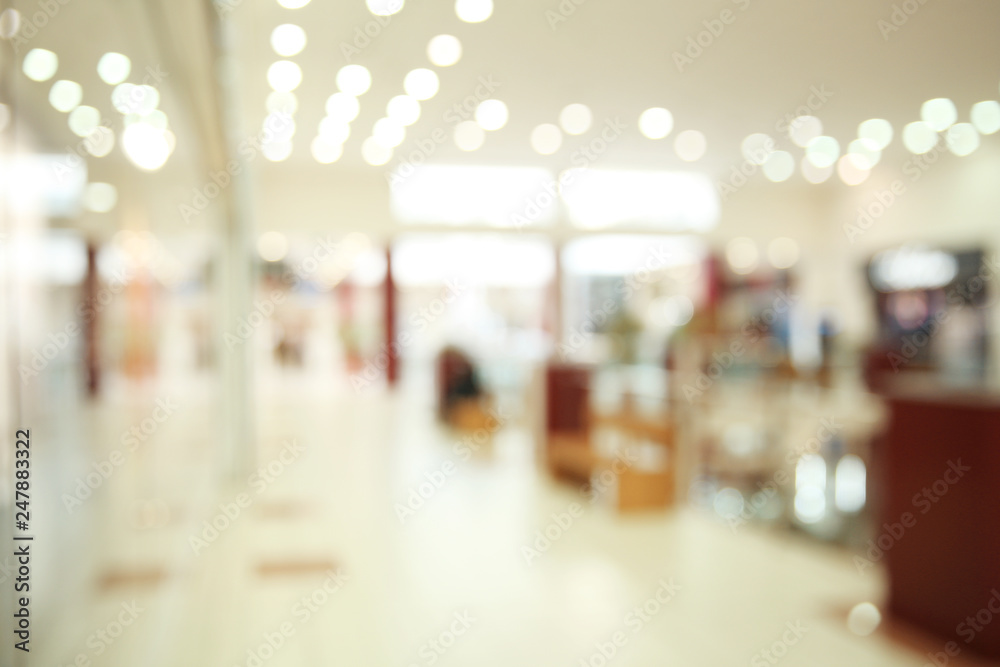 Blurred view of modern shopping mall interior