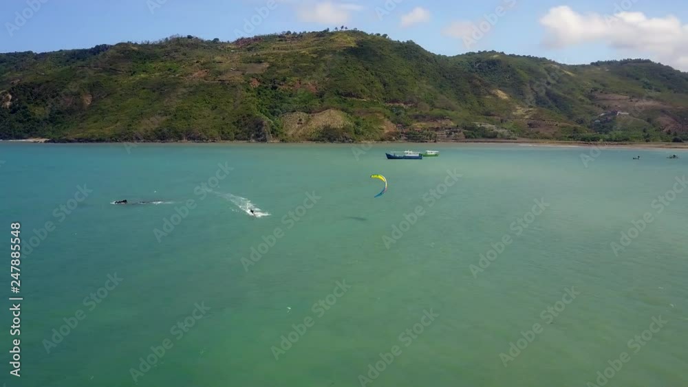 Solo kitesurfing in the tropical location. Aerial footage captured in