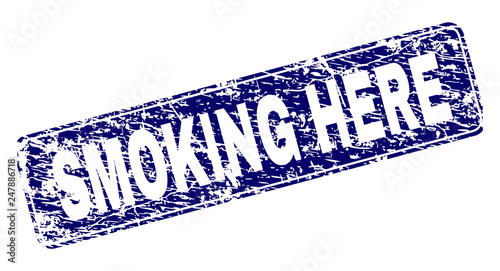 SMOKING HERE stamp seal print with distress texture. Seal shape is a rounded rectangle with frame. Blue vector rubber print of SMOKING HERE text with scratched texture.