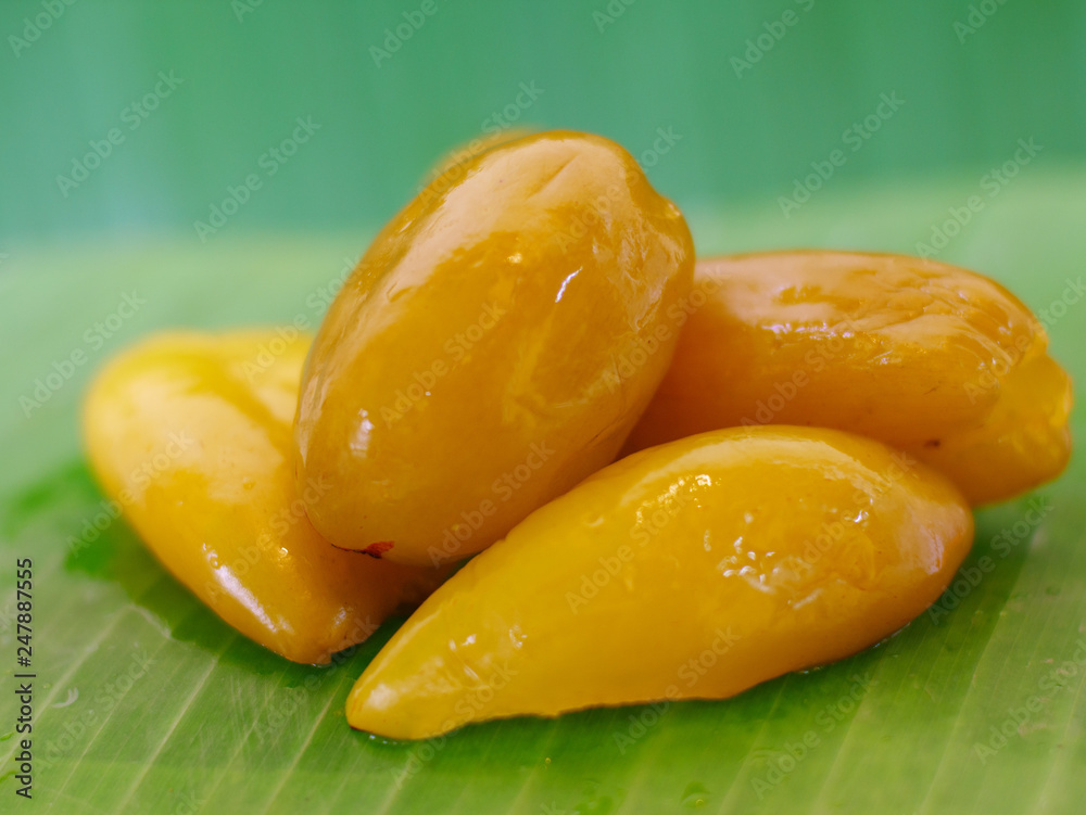 Pickled fruits or preserved sweet fruits in Thailand. Pickled Madun or Garcinia schomburgkiana Pierre fruit 
