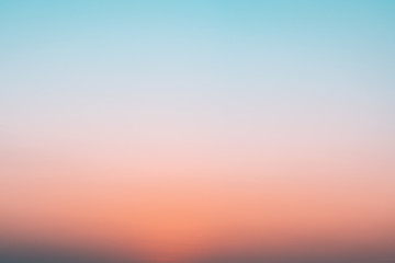 Abstract gradient sunrise in the sky with blue and orange natural background.