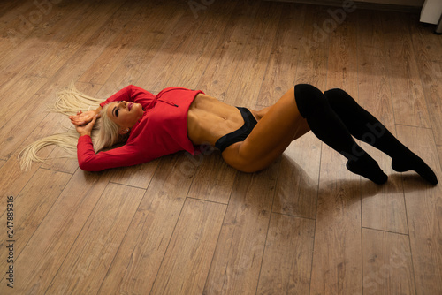 Girl Lying on the Wooden Floor