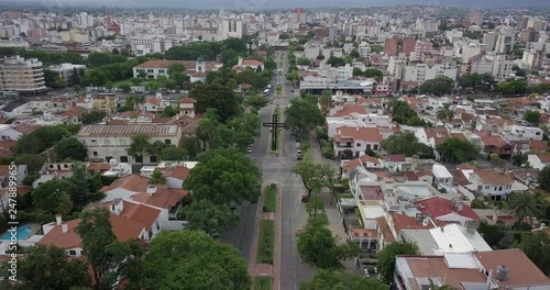 Aerial views panning up across Av. General Marting Miguel de Guemes, Salta, Argentina. photo