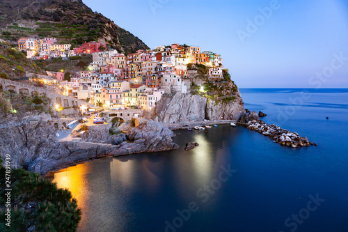 panorama view of Manarola village one of Cinque Terre at night in La Spezia, Italy