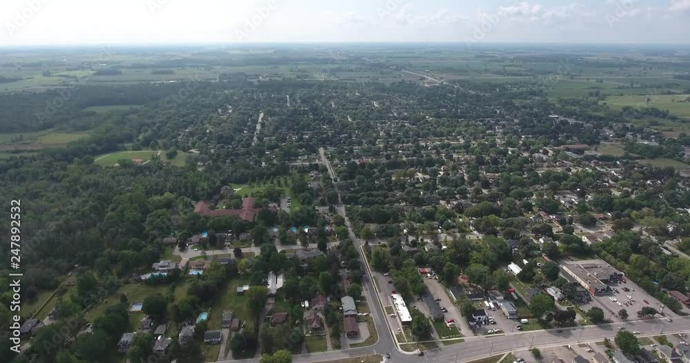 Flying Over Grid Like Neighbourhood Towards Baseball Diamond Field In The Distance