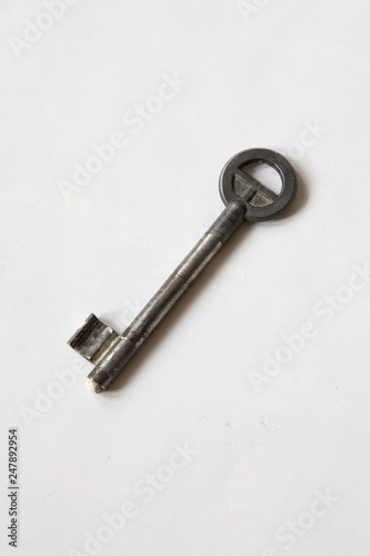 a iron vintage key on white background © tung