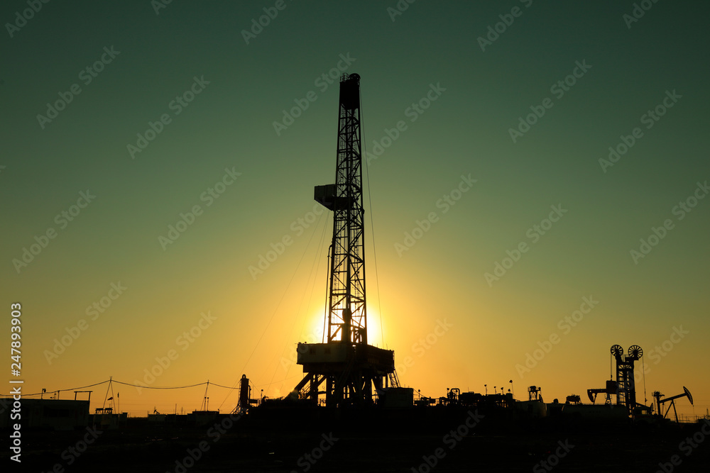 Oil drilling derrick in oilfield