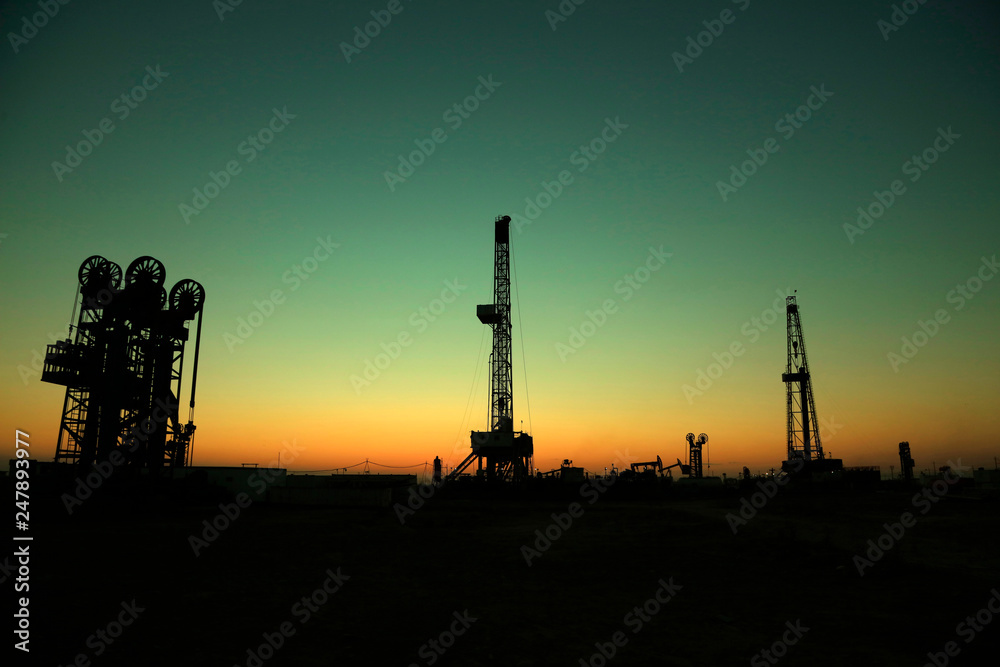 Oil drilling derrick in oilfield