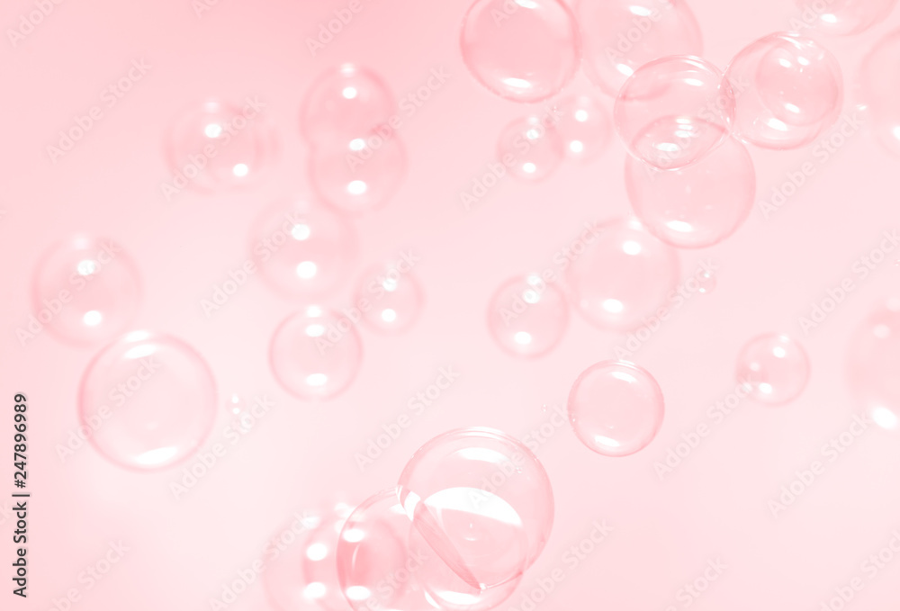 Pink soap bubbles float background.