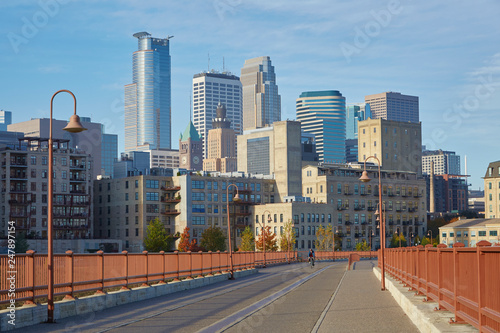 Stone Arch Bridge with downtown Minneapolis Minnesota skyline in the background