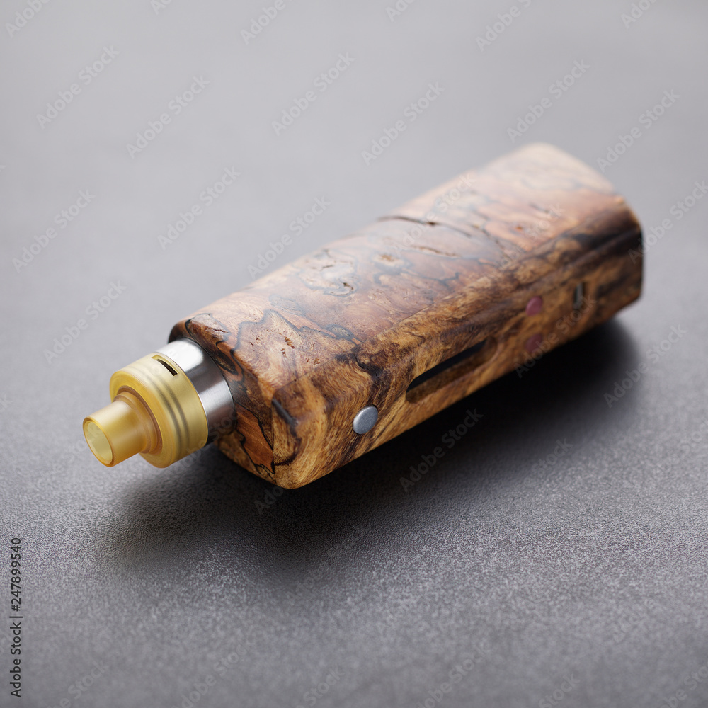 high end rebuildable dripping atomizer with stabilized natural wood regulated box mods, vaping device, selective focus with shallow depth of field