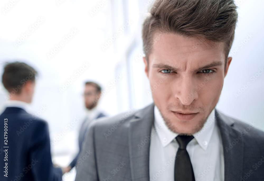 close up.portrait of a serious young businessman close up.portrait of a serious young businessman