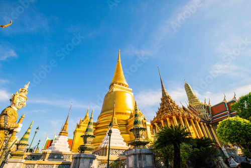 Temple of the emerald buddha golden pagoda with blue sky cloud