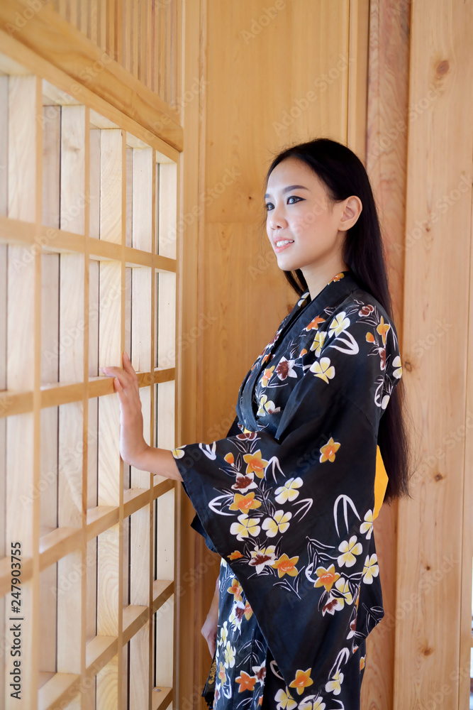 Young asian woman wearing traditional japanese kimono dress Young asian woman wearing traditional japanese kimono dress