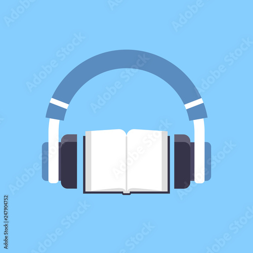 audiobook headphones over open textbook audio book distance education e-learning concept blue background