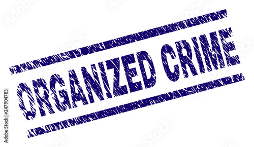 ORGANIZED CRIME seal print with scratced style. Blue vector rubber print of ORGANIZED CRIME text with dust texture. Text title is placed between parallel lines.