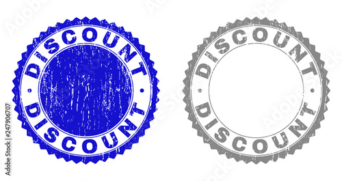 Grunge DISCOUNT stamp seals isolated on a white background. Rosette seals with grunge texture in blue and grey colors. Vector rubber stamp imitation of DISCOUNT text inside round rosette.