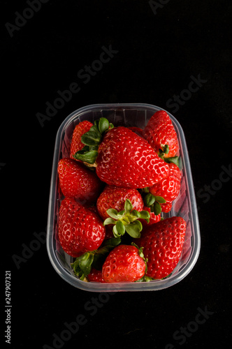 fresh strawberries in box isolated