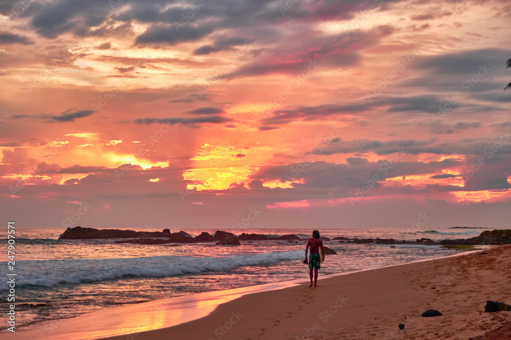 Stunning sunset on the beach overlooking the ocean and the waves. Stunning sunset on the beach overlooking the ocean and the waves.