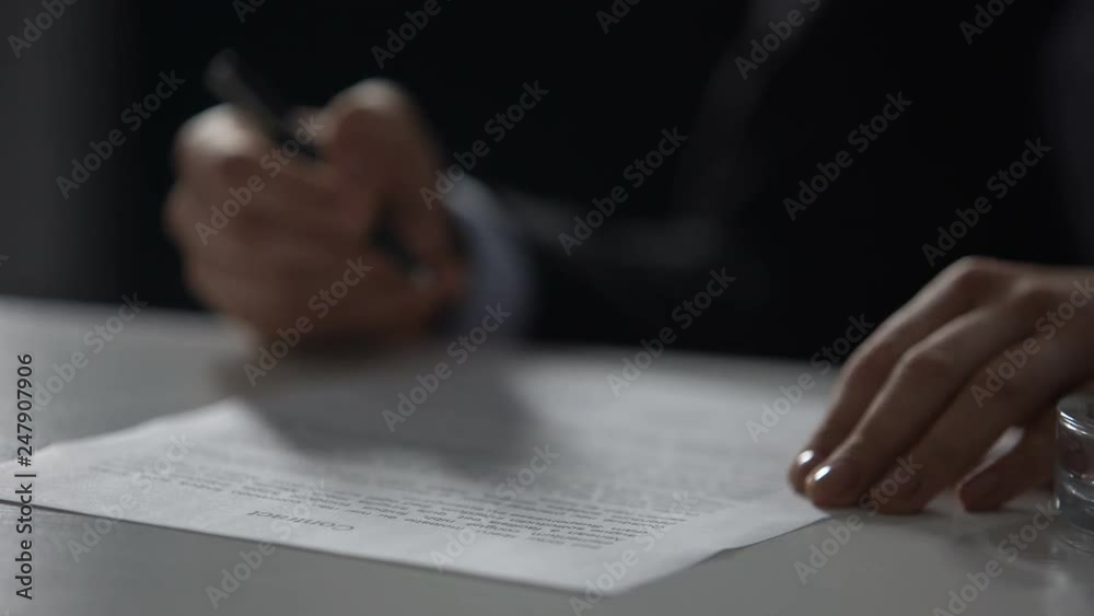 Female boss signing contract and smoking cigarette, nervous work, close-up Female boss signing contract and smoking cigarette, nervous work, close-up