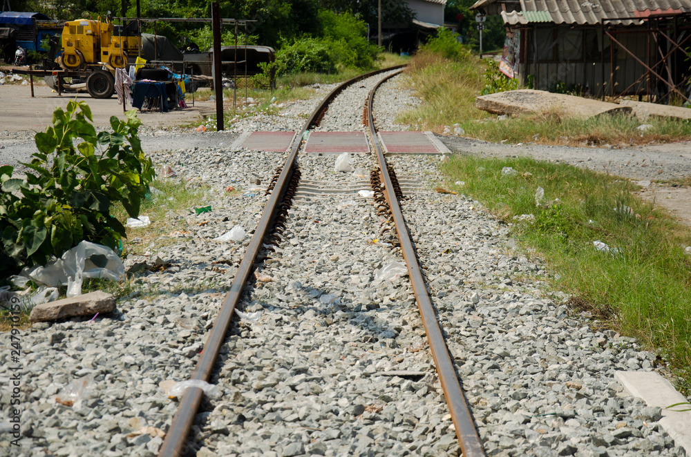 Railroad tracks and railway track tie sleeper for train running in Tha Chalom station at Mahachai city in Samut Sakhon, Thailand