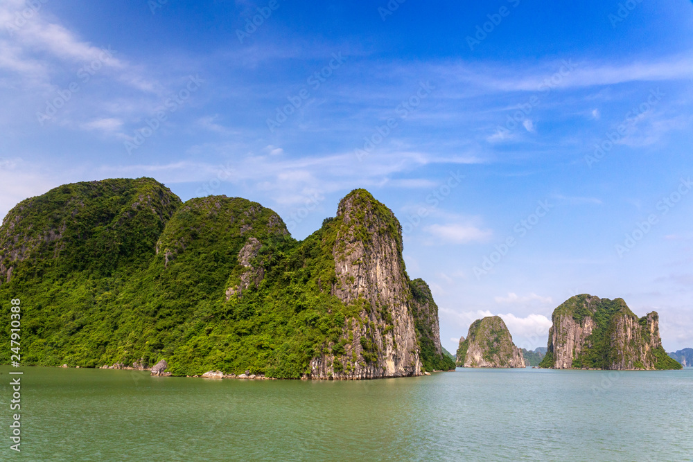 Halong Bay limestone formations on a sunny day, UNESCO world natural Heritage, Vietnam.