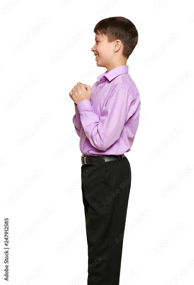 Boy posing on white background, black trousers and purple shirt Boy posing on white background, black trousers and purple shirt