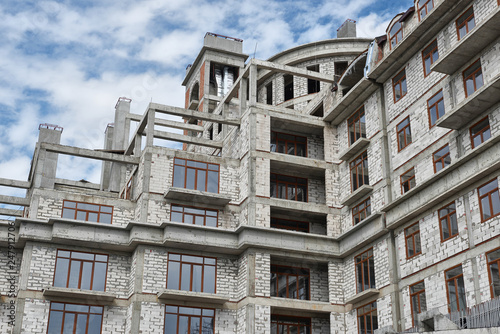 new building under construction, scaffolding and concrete