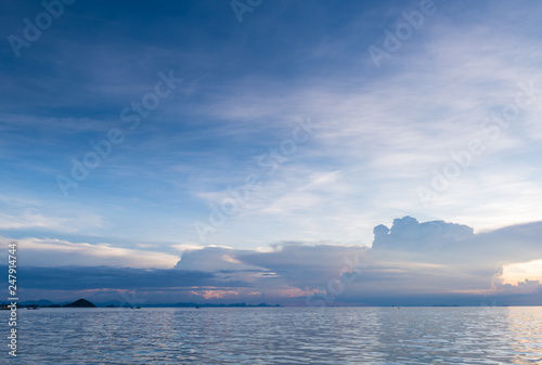 Seascape bright blue sea skay white clouds background