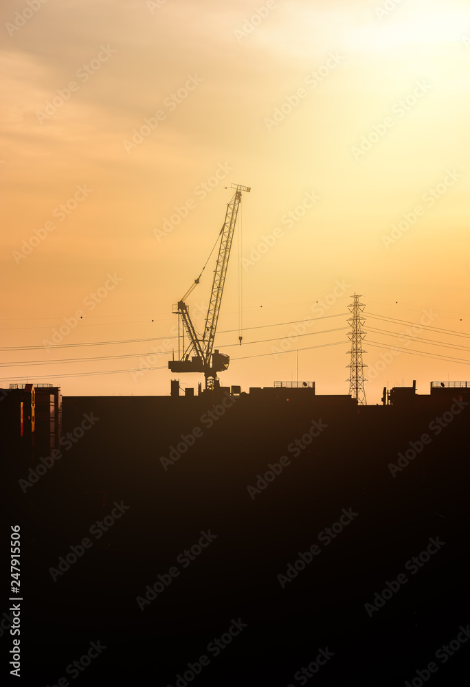 Construction site with cranes against Construction site with cranes against