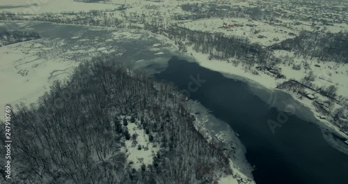 Wallpaper Mural Drone Flies Above Frozen River At Sunset.Drone Fly Over Lake Snow Covered.Frozen field snow and ice.Aerial: Fly Along Coastline With Cold Winter Background.Winter Fly To Frozen Lake Over Trees.  Torontodigital.ca