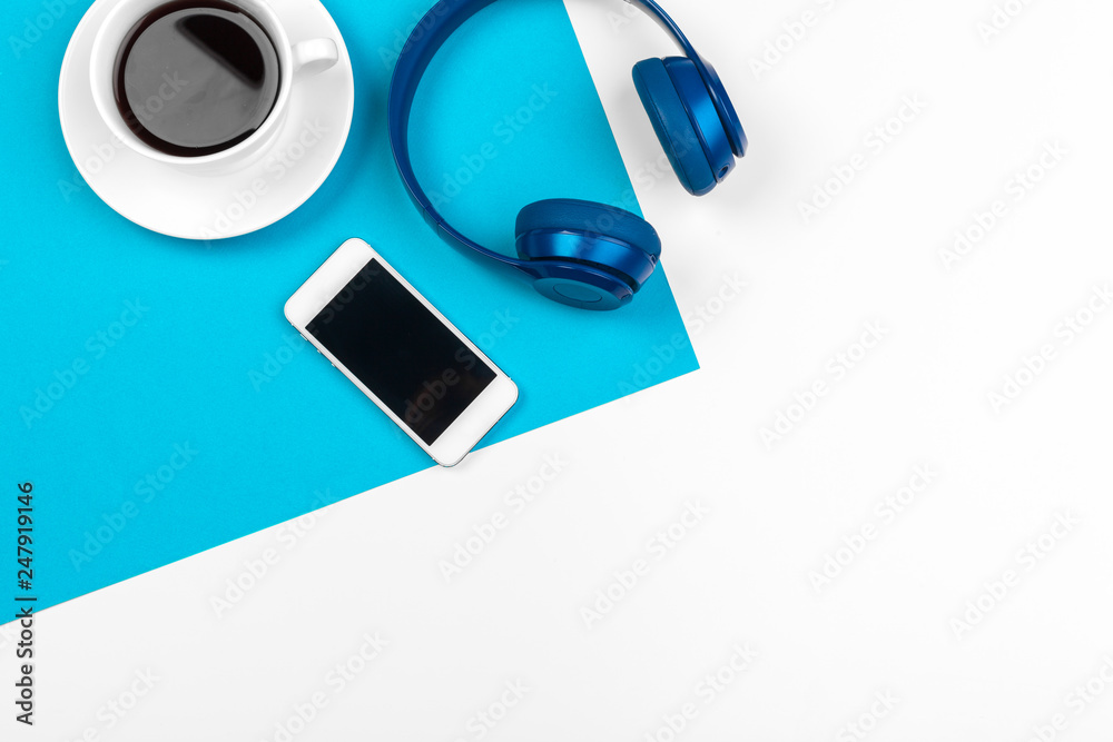 Blue headphones on blue and white color background - obrazy, fototapety, plakaty 