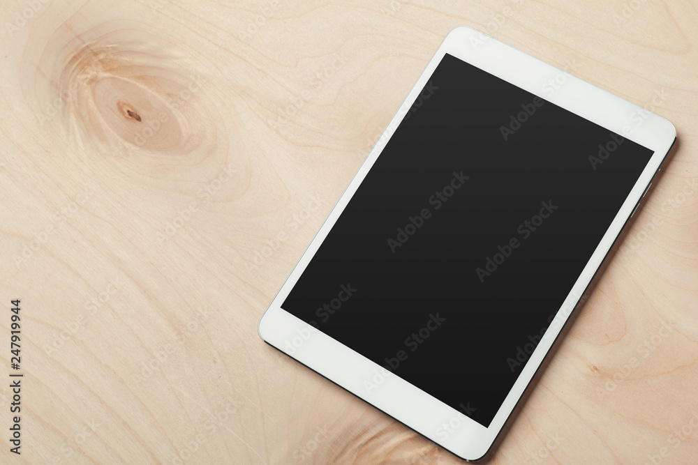 digital tablet on wooden table digital tablet on wooden table