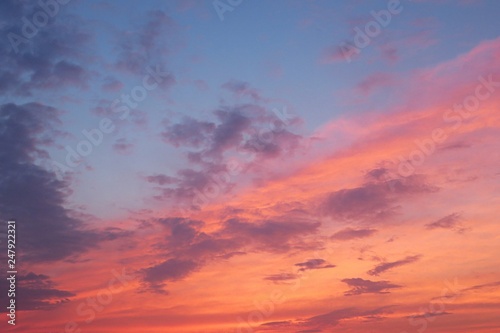 Beautiful fiery pink sunset in blue sky, natural background 