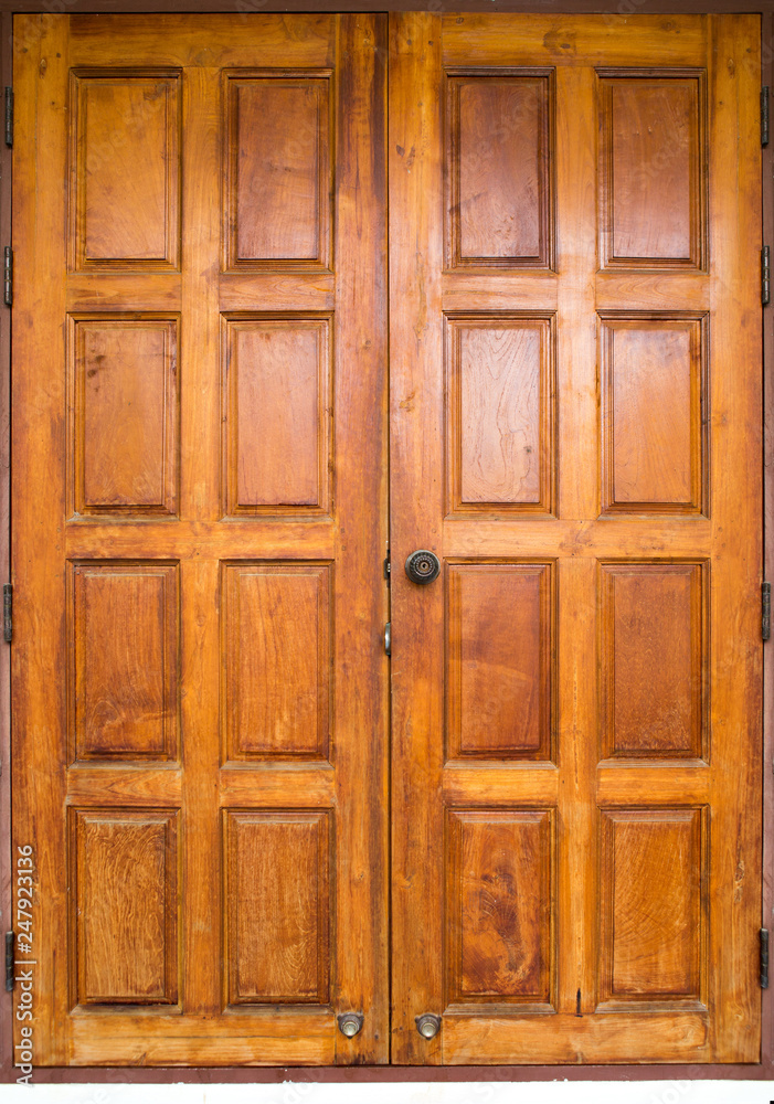 Double wooden doors closed for the surface and the background. Double wooden doors closed for the surface and the background.