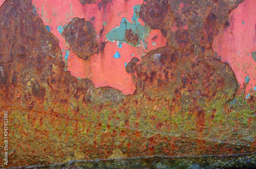 The texture of iron painted with different layers of color paint