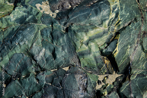 Bild auf Leinwand The surface of an old rock with cracks