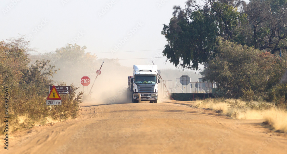 Fototapeta premium Truck on a dirt gravel road