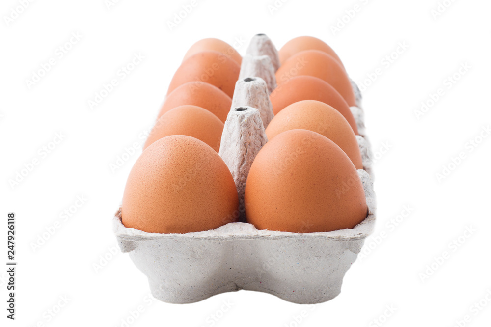 Chicken eggs in carton box isolated on white background.