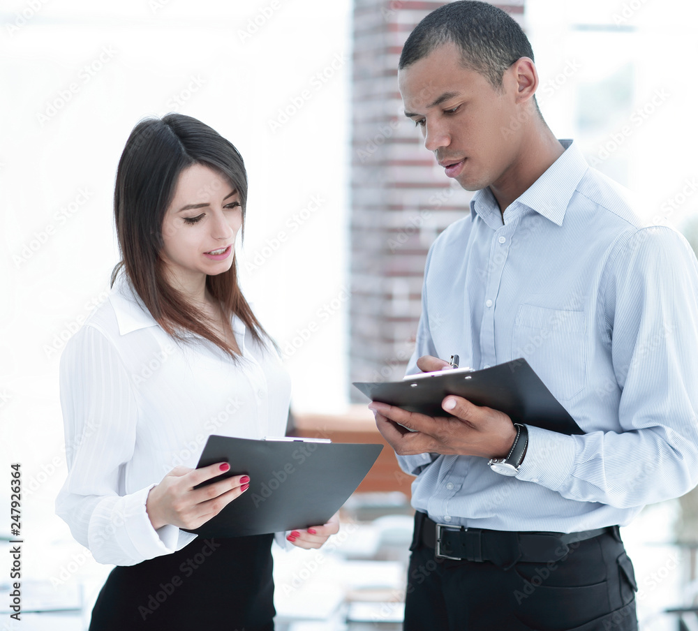 businessman and the employee discussing work schedule. businessman and the employee discussing work schedule.