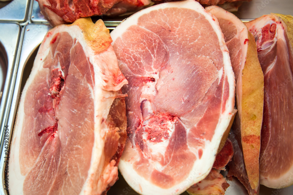 Superb raw juicy pork meat from the counter. lose up. Cross section of a piece of raw pork meat in a organic market.