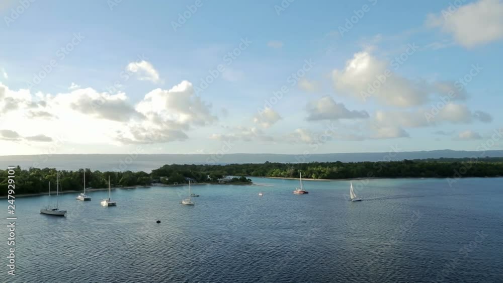Sail boat, yacht, sails into harbour at Port Vila, Vanuatu