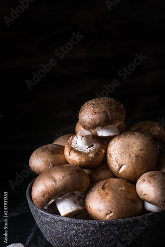 Harvest of mushrooms in plate. Selective focus. Royal champignon. Vegan. Vegetarian food, Vitamin. Healthy food. Process of cooking.