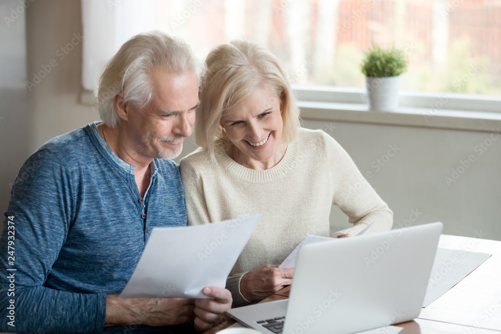 Satisfied retiree spouses feels happy received good news from bank Satisfied retiree spouses feels happy received good news from bank