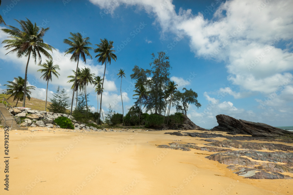 Beautiful view of Batu Pelanduk, Terengganu. Blue sky scene with waves motion between rocks at the beach. Beautiful view of Batu Pelanduk, Terengganu. Blue sky scene with waves motion between rocks at the beach.