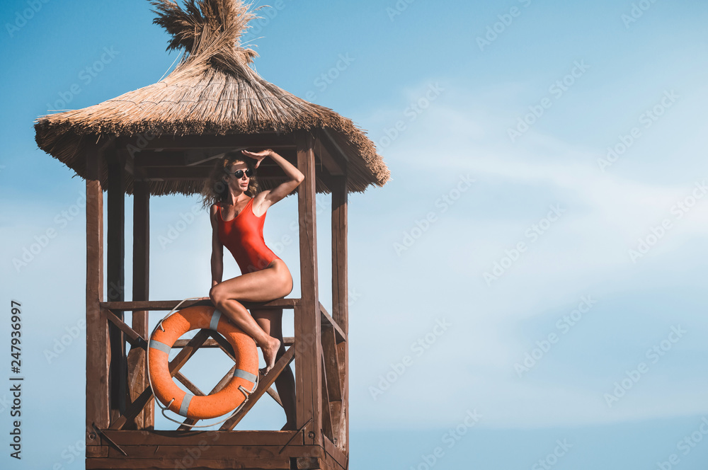 young lifeguard woman on the tower. baywatch.