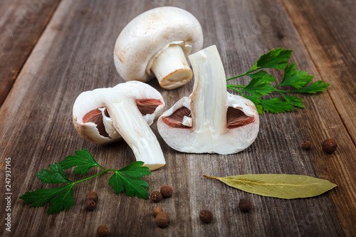 Mushrooms, spices on the wooden background