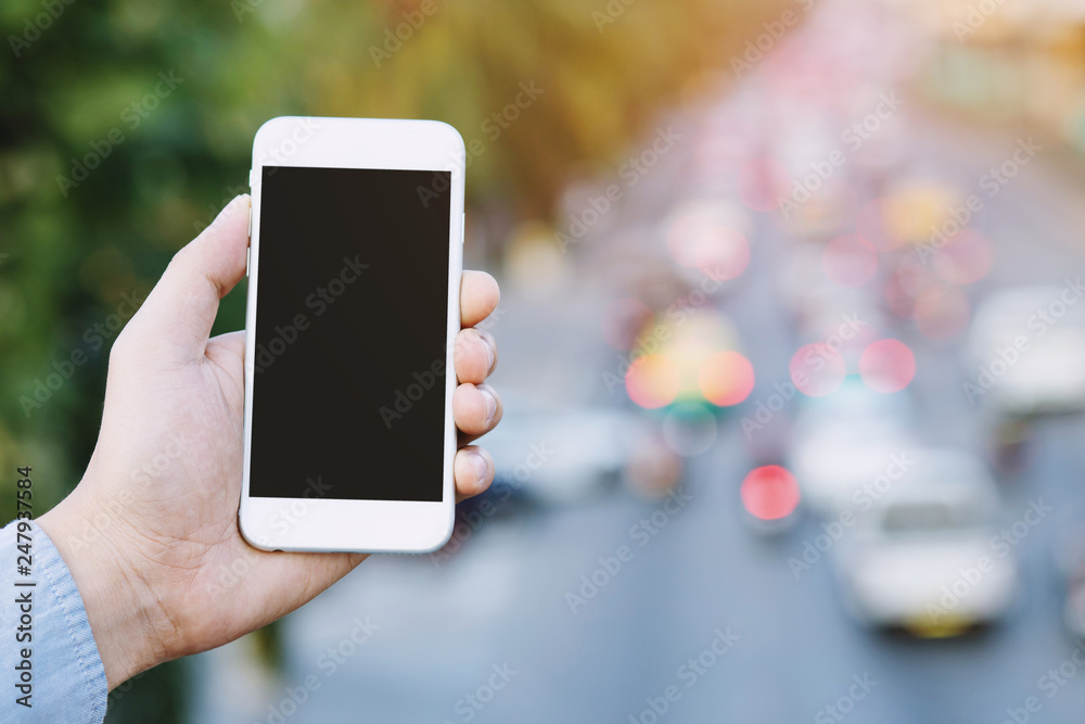 close up people hand holding display white mobile smart phone Traffic applications close up people hand holding display white mobile smart phone Traffic applications