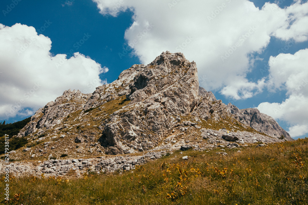 Fototapeta premium Huge rock between the clouds.
