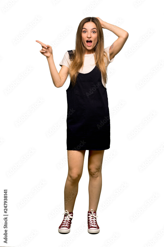 Full body Young pretty woman pointing finger to the side and presenting a product on isolated background Full body Young pretty woman pointing finger to the side and presenting a product on isolated background